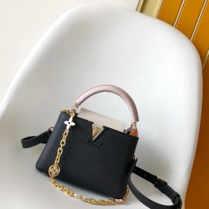 p1080M11343 Pure White with Pink M25386 Black with White M23952 White with Blue M24471 Green M22514 White with Yellow M22375 Crocus M20845 Pure White M20844 Peach Pink M22512 Black with Pink Premium Genuine Leather Dynamic Encryption Chip This Capucines Mini Bag features a Taurillon leather body with an elegant Lovelock chain, where woven chain links accentuate hand-painted enamel Monogram elements and an LV monogram padlock. A leather LV logo adds a striking touch.26.5 x 17.5 x 9.0 cm (L x H x W) 21.0 x 14.0 x 8.0 cm (L x H x W) 16.3 x 11.0 x 6.5 cm (L x H x W) • Taurillon leather • Taurillon leather trim •Cowhide lining•Metal hardware•Glazed effect•Flap can be positioned inside or outside•Interior compartment with patch pocket•Metal studs•Shoulder strap: Detachable, adjustable•Strap length: 55.0 cm•Adjustable to: 59.0 cm•Chain: Detachable•Chain length: 31.0 cm • Handle: Single handle